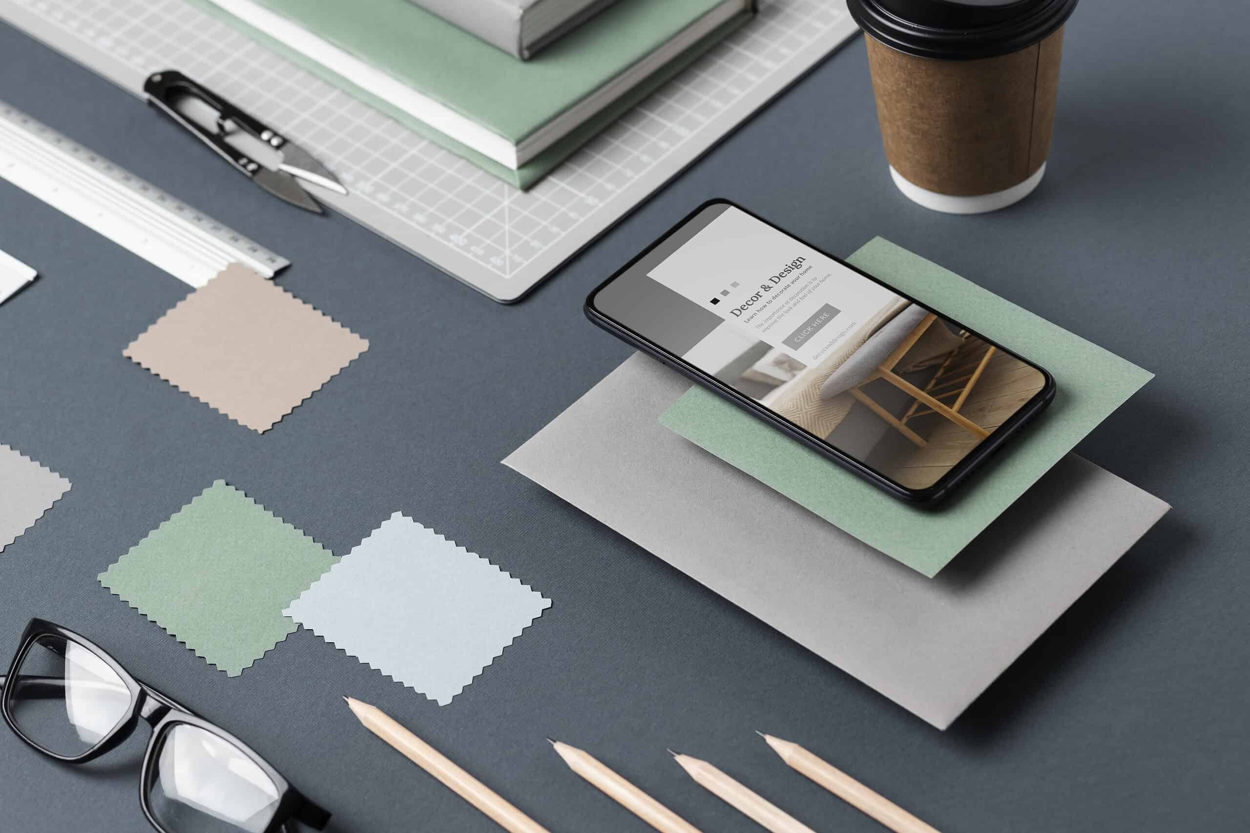 A professional desk setup featuring color swatches, a digital tablet with a website mockup, and high-end stationery, representing a comprehensive Branding Services Albania style guide.